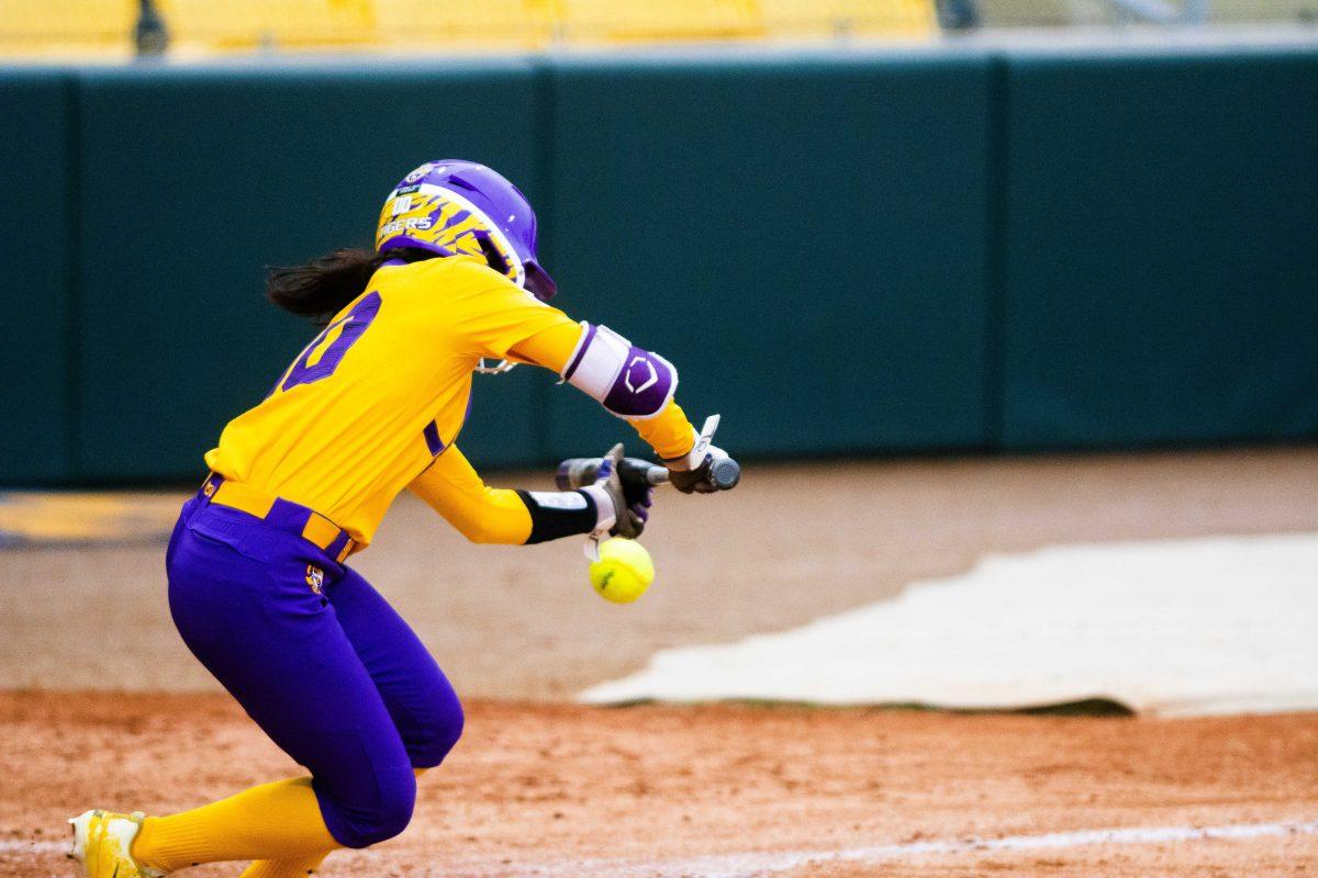 LSU softball freshman outfielder Madilyn Giglio (9) bunts the ball down during the Purple and Gold World Series on Thursday, Nov. 18, 2021, at Tiger Park in Baton Rouge, La.