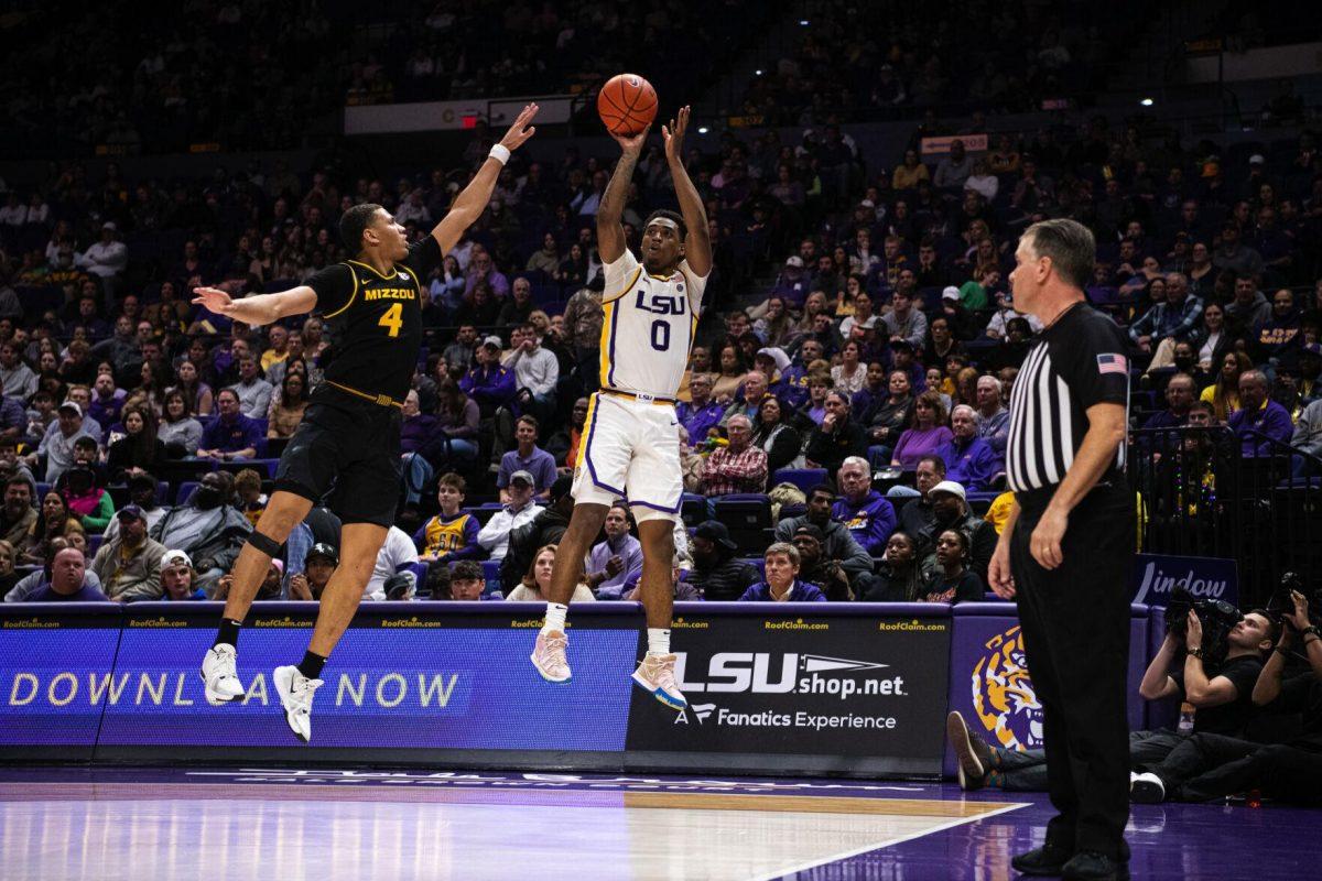 LSU men&#8217;s basketball freshman guard Brandon Murray (0) shoots a three-pointer over a defender Saturday, Feb. 26, 2022, during LSU&#8217;s 75-55 win against Missouri in the Pete Maravich Assembly Center on North Stadium Drive in Baton Rouge, La.