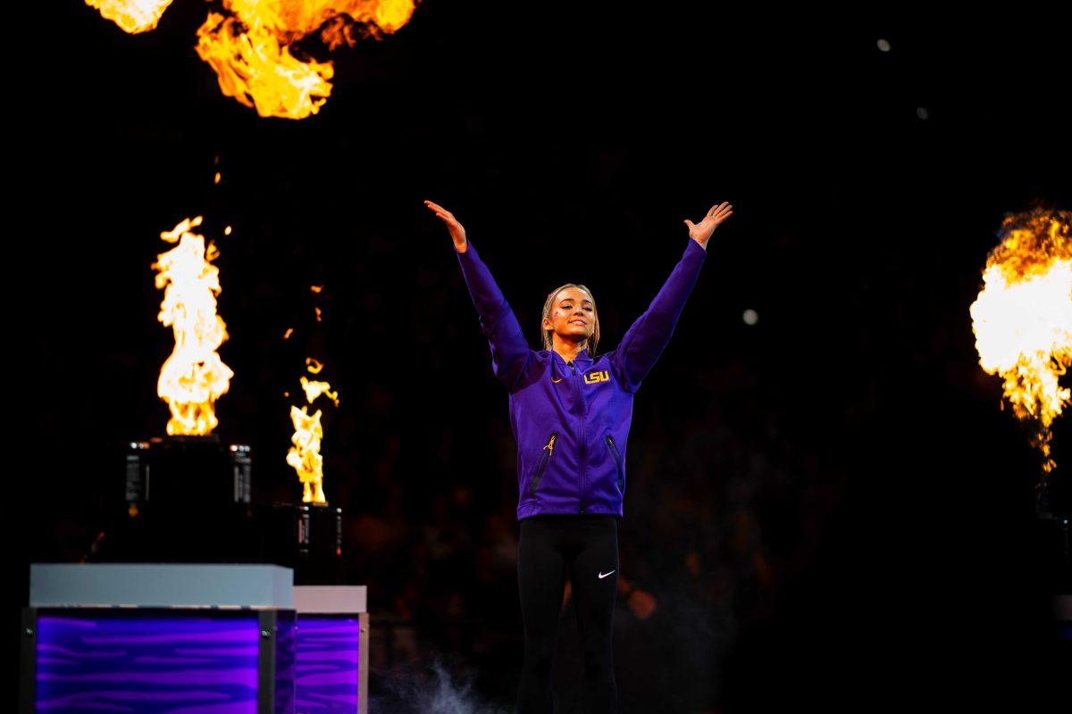 LSU gymnastics sophomore all-around Olivia Dunne waves to the crowd Saturday, Feb. 5, 2022 before LSU's 197.975-197.750 win over Auburn in the Pete Maravich Assembly Center on N. Stadium Drive in Baton Rouge, La.