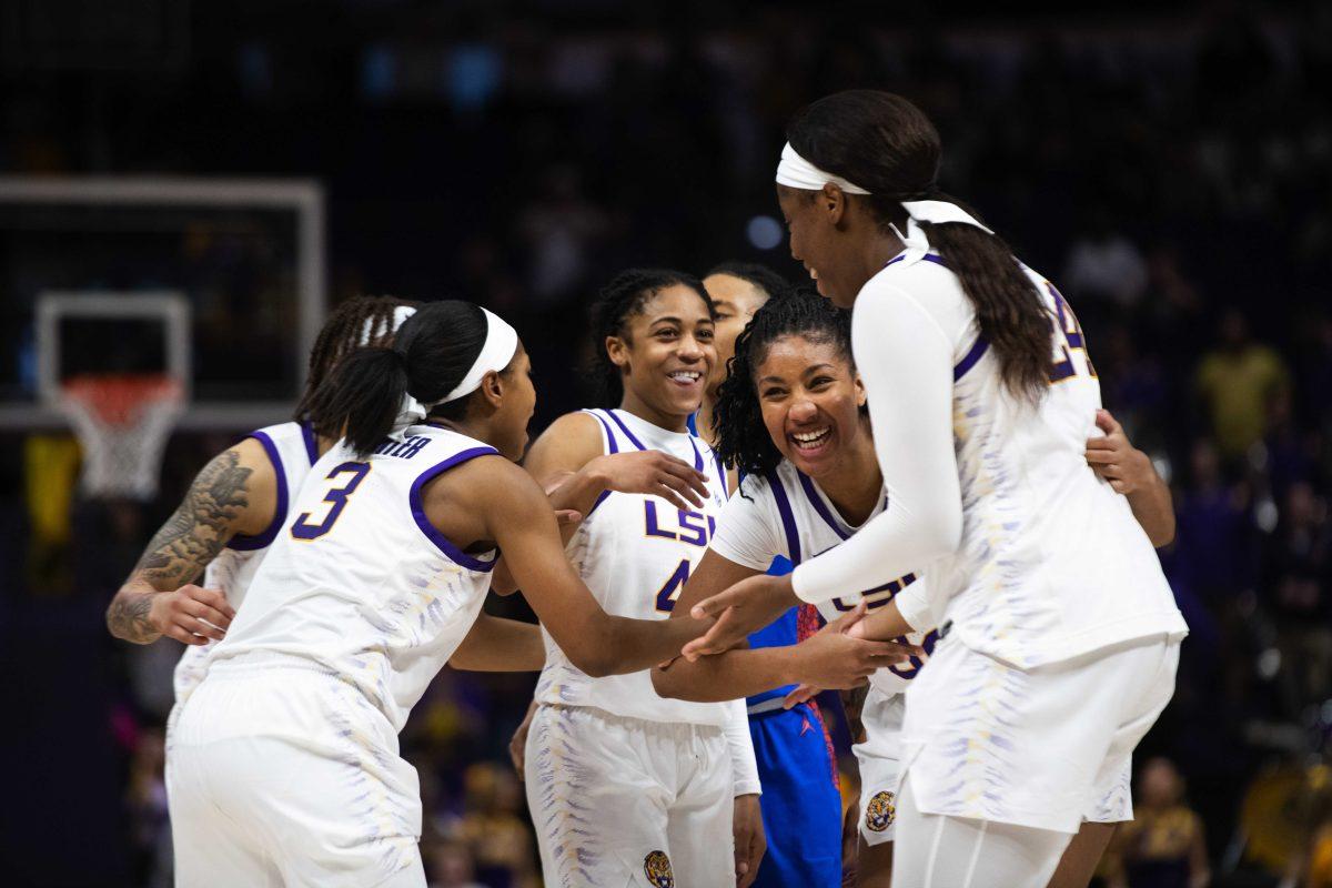 The LSU women's basketball team smile as they secure the win Sunday, Feb. 20, 2022, during LSU&#8217;s 66-61 win against Florida in the Pete Maravich Assembly Center on North Stadium Drive in Baton Rouge, La.