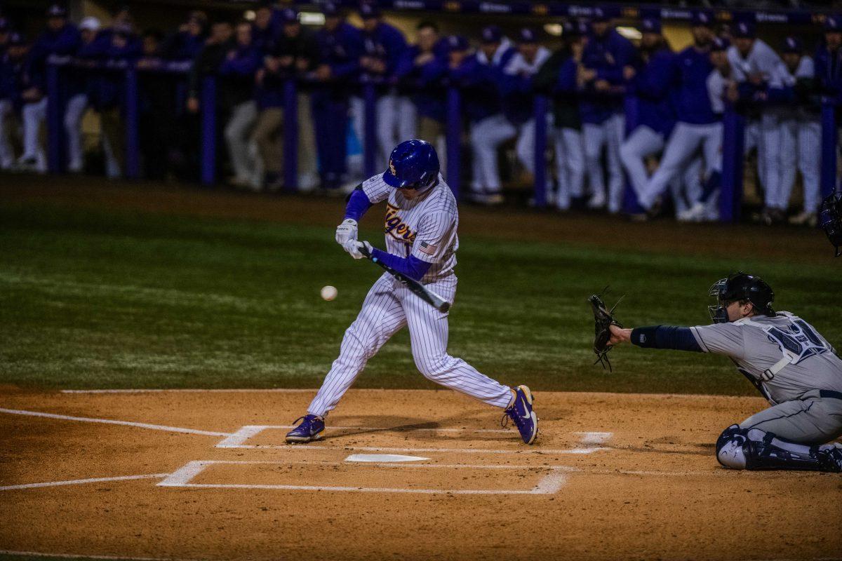 LSU baseball sophomore infielder Jacob Berry (14) hits the ball Friday, Feb. 18, 2022 during LSU's 13-1 win against Maine at Alex Box Stadium on Gourrier Avenue in Baton Rouge, La.