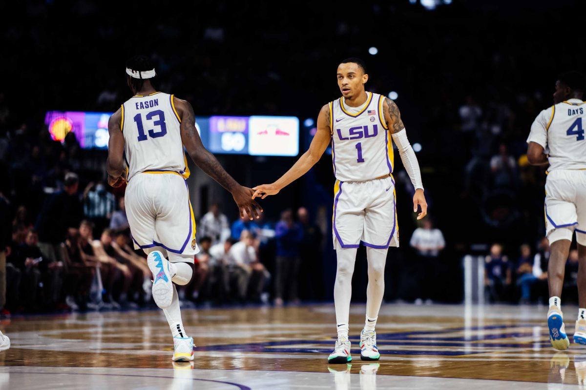 LSU men's basketball senior Xavier Pinson (1) high fives sophomore forward Tari Eason (13) after he makes a jump shot Monday, Nov. 22, 2021, during LSU's 83-53 win over Belmont in the Pete Maravich Assembly Center in Baton Rouge, La.