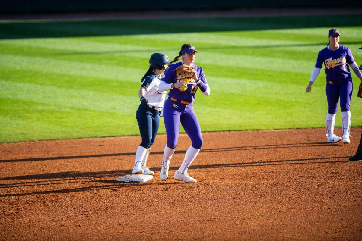 LSU softball redshirt sophomore infielder Taylor Pleasants (17) tags the runner to end the inning Friday, Feb. 11, 2022, during the Tigers' 3-0 win against South Alabama at Tiger Park in Baton Rouge, La.