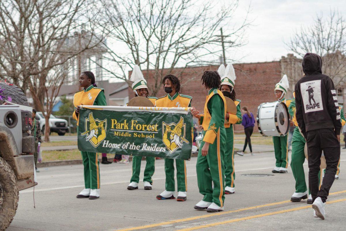 The Park Forest Middle School Band marches down the street on Sunday, Feb. 20, 2022, as part of the Mid City Gras parade on North Boulevard in Baton Rouge, La.