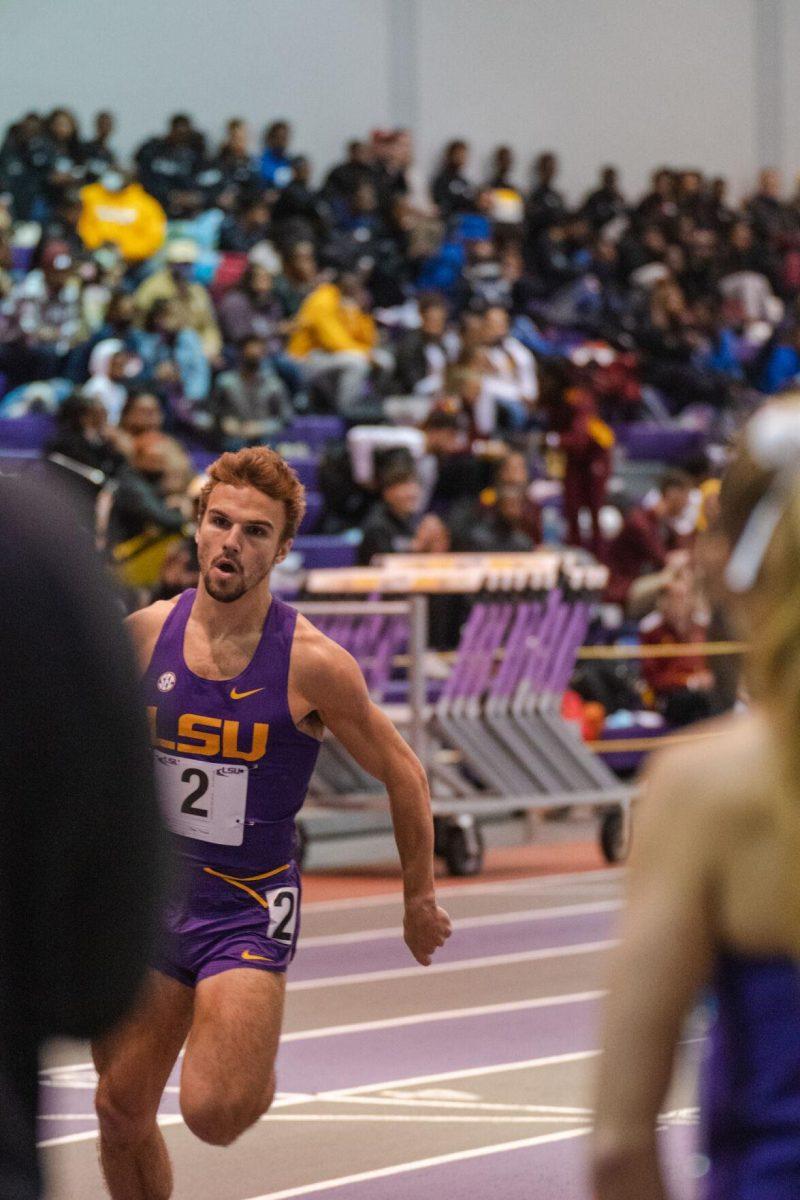 LSU track and field junior Adam Wise rounds the bend on Friday, Feb. 4, 2022, during the Bayou Bengal indoor track meet at the Carl Maddox Field House on Nicholson Drive in Baton Rouge, La.