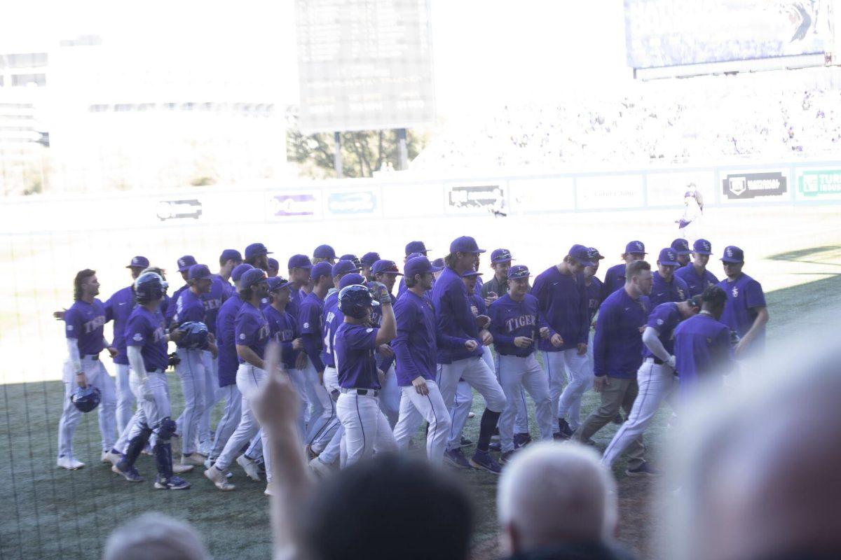 The LSU baseball team walks back to the dugout after a home run Saturday, Feb. 19, 2022, during the Tigers' 17-8 win against the University of Maine at Alex Box Stadium in Baton Rouge, La.