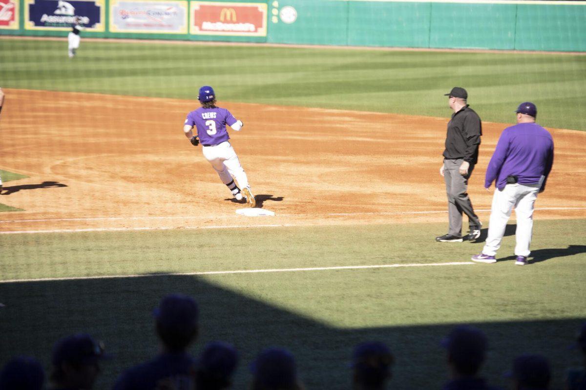 LSU sophomore outfielder Dylan Crews (3) runs past first base Saturday, Feb. 19, 2022, during the Tigers' 17-8 win against the University of Maine at Alex Box Stadium in Baton Rouge, La.