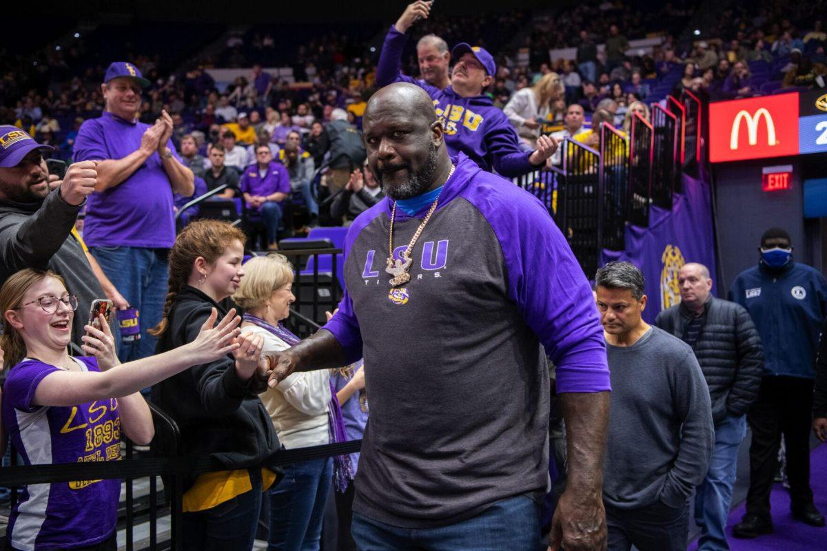 Former LSU basketball player Shaquille O&#8217;Neal fist bumps a fan Saturday, Feb. 26, 2022, during LSU&#8217;s 75-55 win against Missouri in the Pete Maravich Assembly Center on North Stadium Drive in Baton Rouge, La.