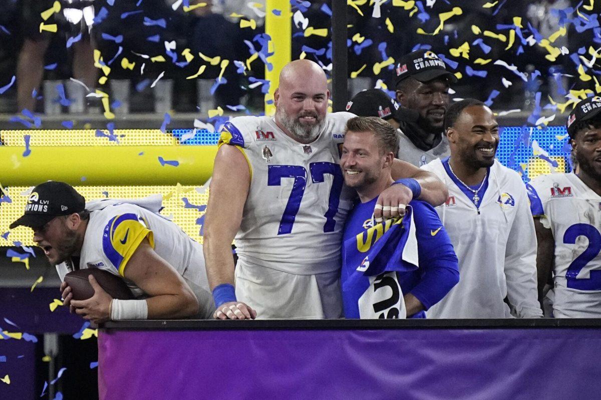 Los Angeles Rams head coach Sean McVay hugs offensive tackle Andrew Whitworth (77) after the NFL Super Bowl 56 football game against the Cincinnati Bengals, Sunday, Feb. 13, 2022, in Inglewood, Calif. The Rams defeated the Bengals 23-20. (AP Photo/Ted S. Warren)