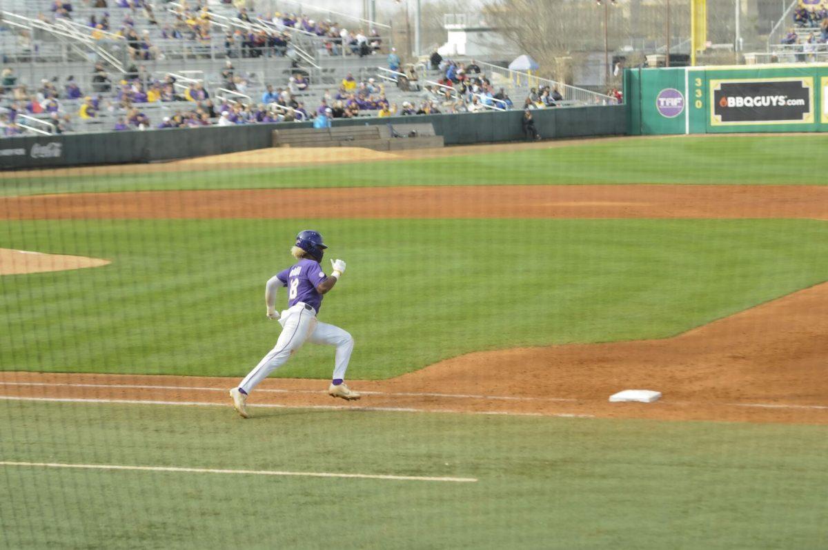 LSU sophomore first basemen Tre' Morgan (18) runs for the double Saturday, Feb. 26, 2022, during the Tigers' 9-2 win against Southern University at Alex Box Stadium in Baton Rouge, La.