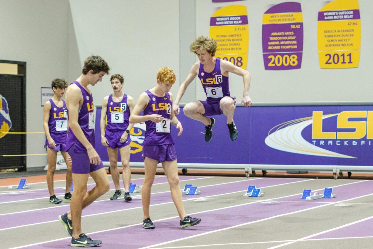 LSU track and field distance runners loosen up prior to their 3000-meter run on Friday, Feb. 18, 2022, during the LSU Twilight track and field meet in the Carl Maddox Field House on Nicholson Drive in Baton Rouge, La.