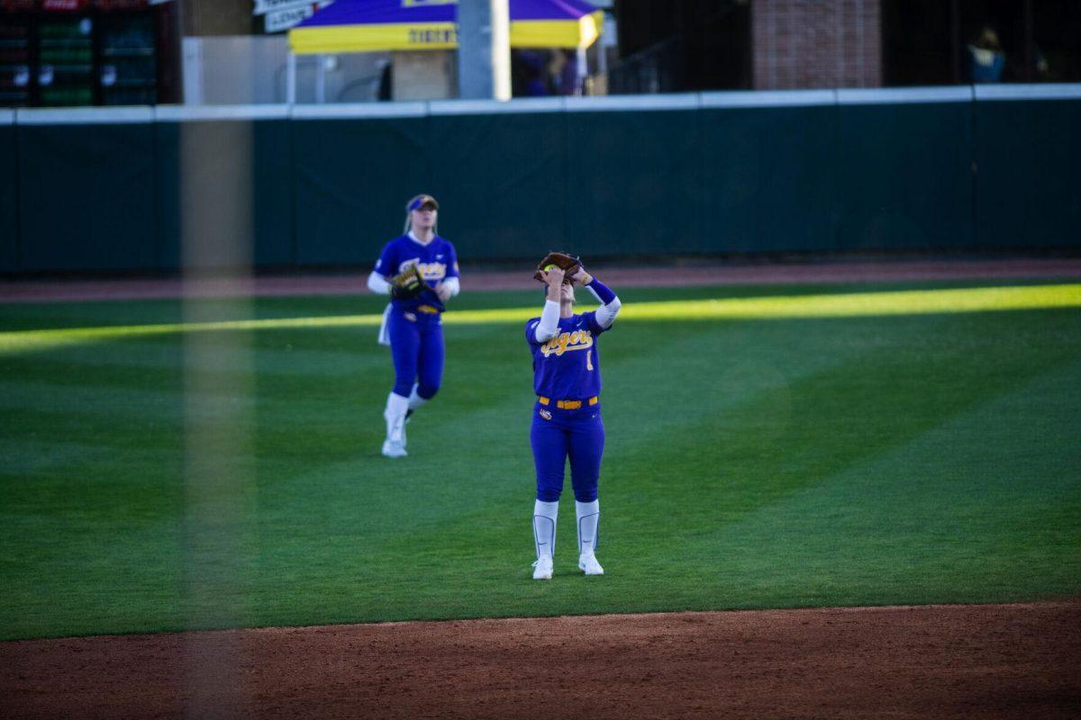 LSU softball freshman infielder Sydney Peterson (1) catches a fly ball Friday, Feb. 11, 2022, during the Tigers' 3-0 win against South Alabama at Tiger Park in Baton Rouge, La.