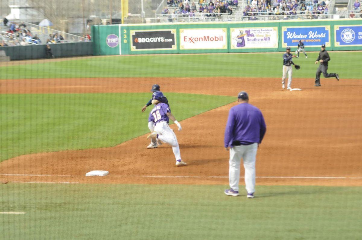 LSU sophomore first basemen Tre' Morgan (18) runs for the double Saturday, Feb. 26, 2022, during the Tigers' 9-2 win against Southern University at Alex Box Stadium in Baton Rouge, La.