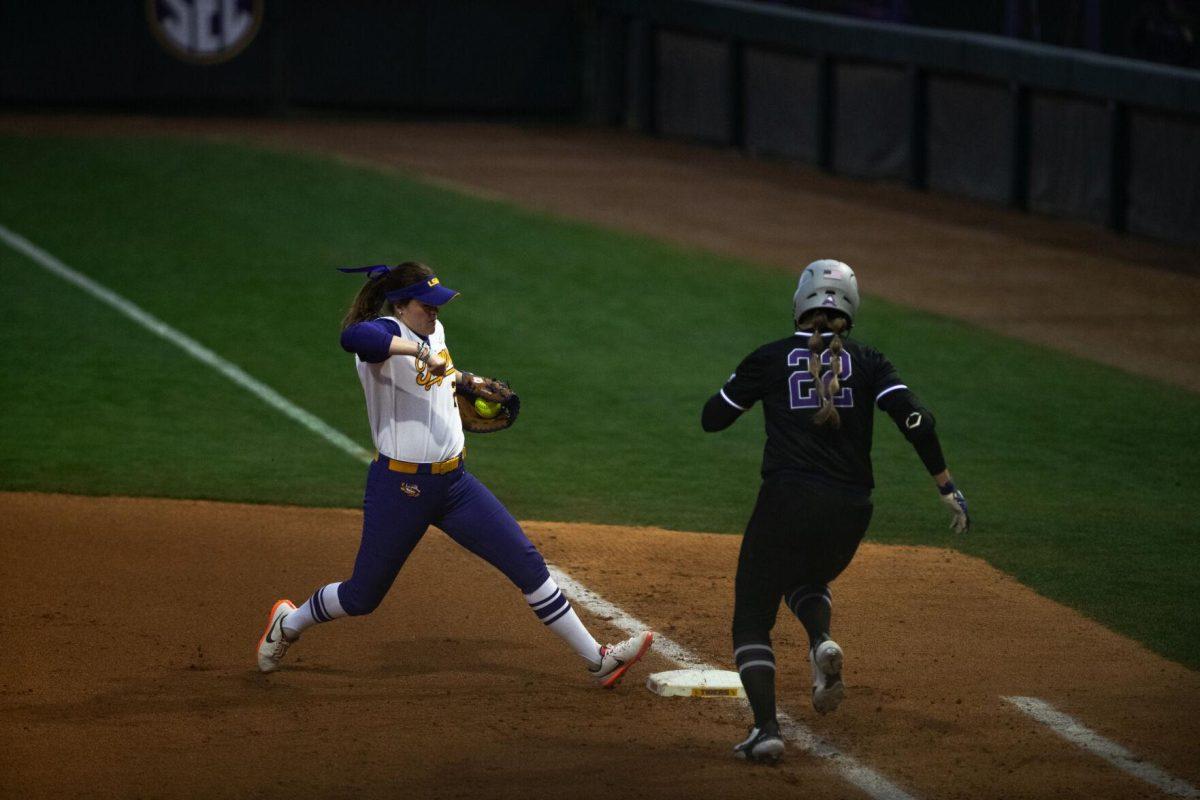 LSU softball junior infielder Georgia Clark (25) beats Central Arkansas softball infielder/pitcher Jaylee Engelkes (22) to first base Saturday, Feb. 12, 2022, during LSU’s 2-3 loss against Central Arkansas at Tiger Park on Skip Bertman Drive in Baton Rouge, La.