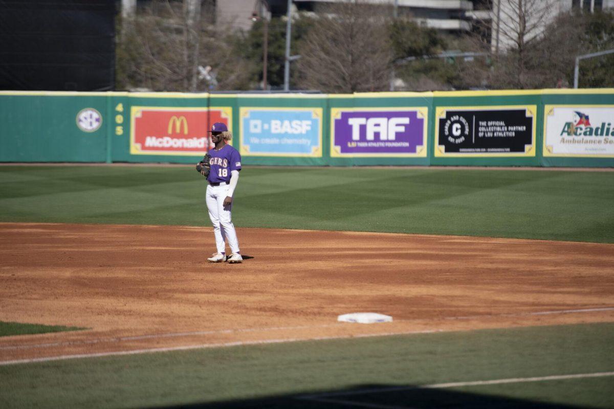 LSU sophomore first basemen Tre' Morgan (18) stands near first base Saturday, Feb. 19, 2022, during the Tigers' 17-8 win against the University of Maine at Alex Box Stadium in Baton Rouge, La.