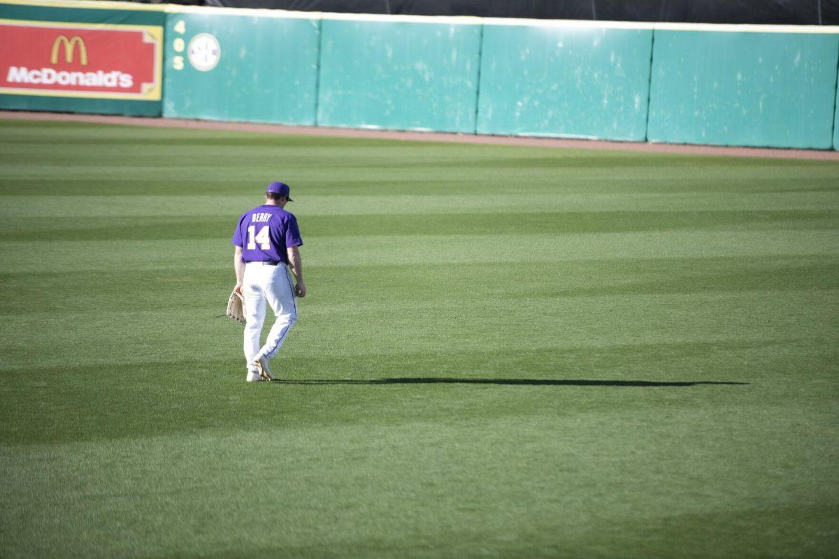 LSU sophomore infielder Jacob Berry (14) walks to his spot Saturday, Feb. 19, 2022, during the Tigers' 17-8 win against the University of Maine at Alex Box Stadium in Baton Rouge, La.