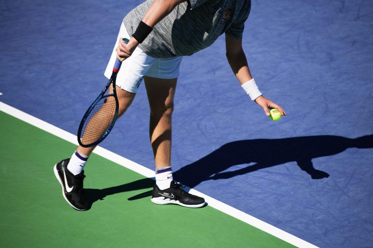 LSU men's tennis junior Boris Kozlov prepares to serve Sunday, Feb. 13, 2021 during LSU's 6-1 win over Purdue at the LSU Tennis Complex on Gourrier Avenue in Baton Rouge, La.