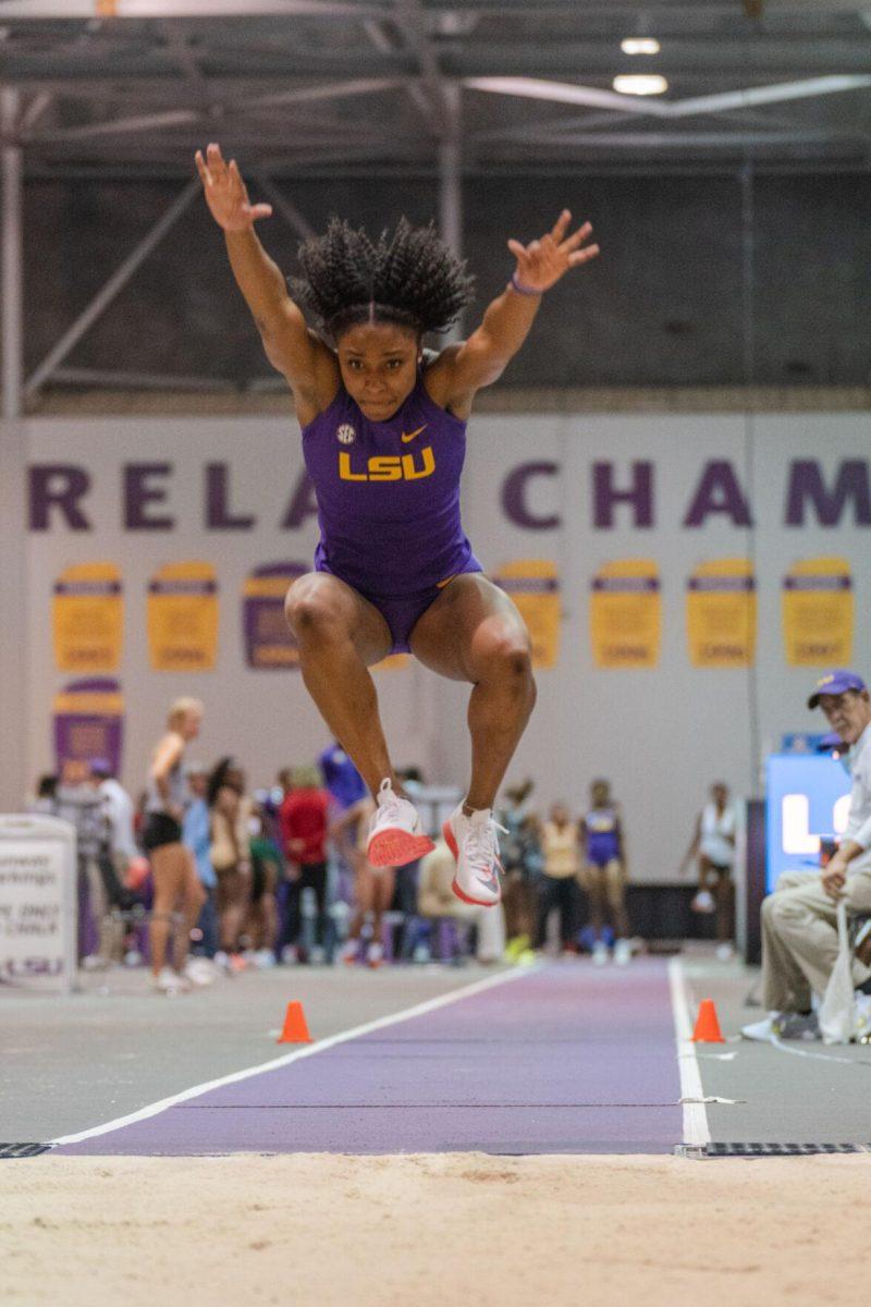 LSU track and field fifth-year senior Kyndal McKnight flies over the sand on Friday, Feb. 4, 2022, during the Bayou Bengal indoor track meet at the Carl Maddox Field House on Nicholson Drive in Baton Rouge, La.