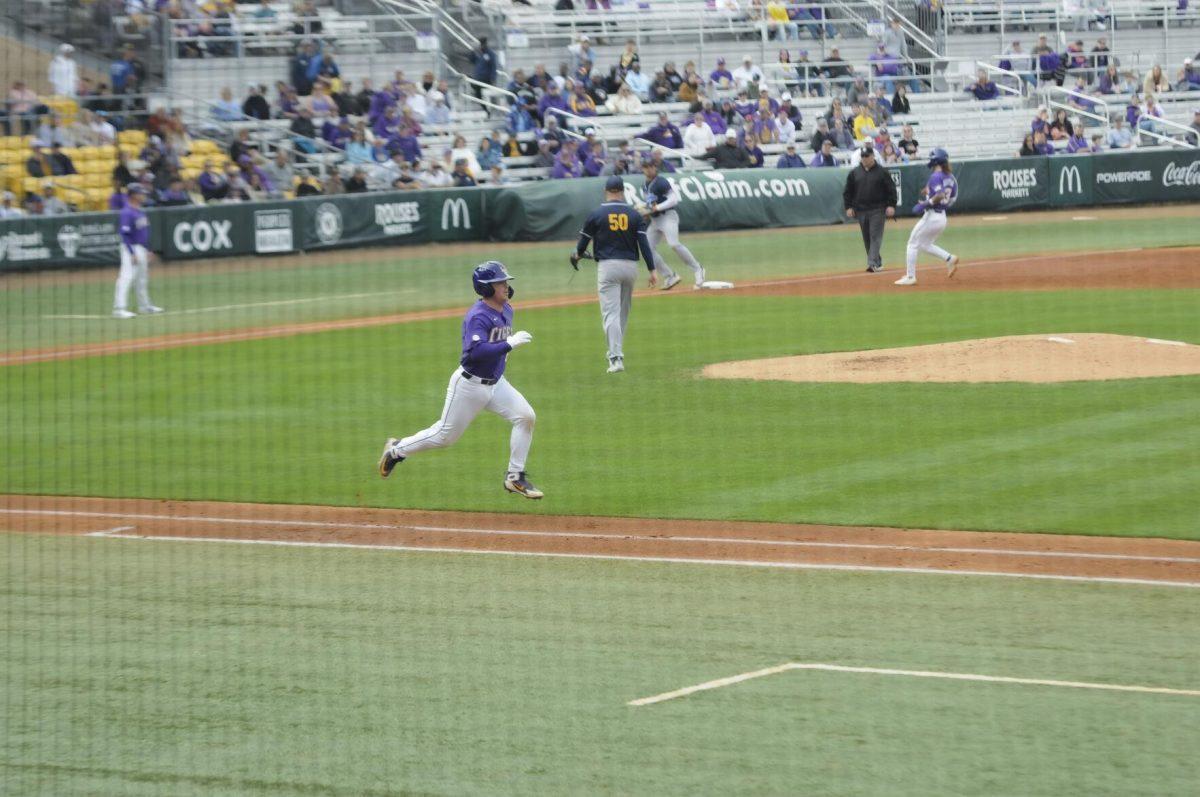 LSU sophomore catcher Alex Milazzo (20) runs to first base Saturday, Feb. 26, 2022, during the Tigers' 9-2 win against Southern University at Alex Box Stadium in Baton Rouge, La.