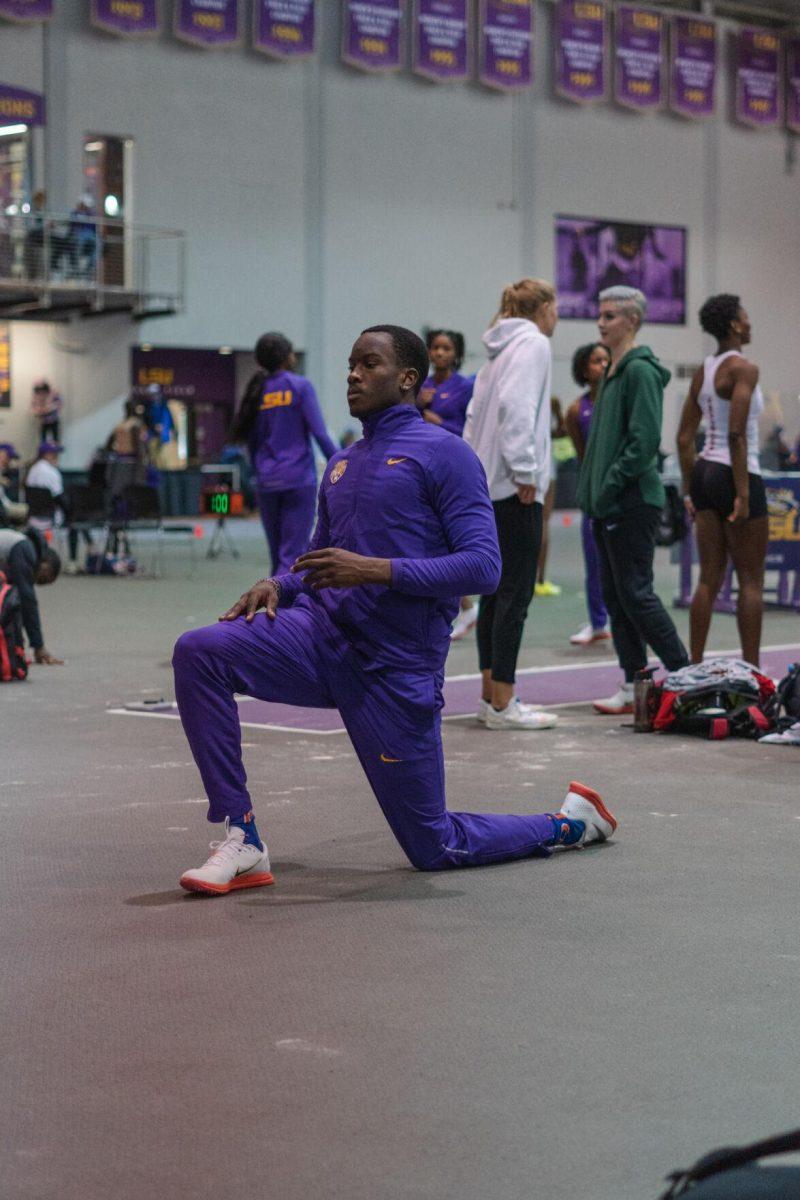 LSU track and field sophomore Sean Dixon-Bodie stretches between jumps legs on Friday, Feb. 4, 2022, during the Bayou Bengal indoor track meet at the Carl Maddox Field House on Nicholson Drive in Baton Rouge, La.