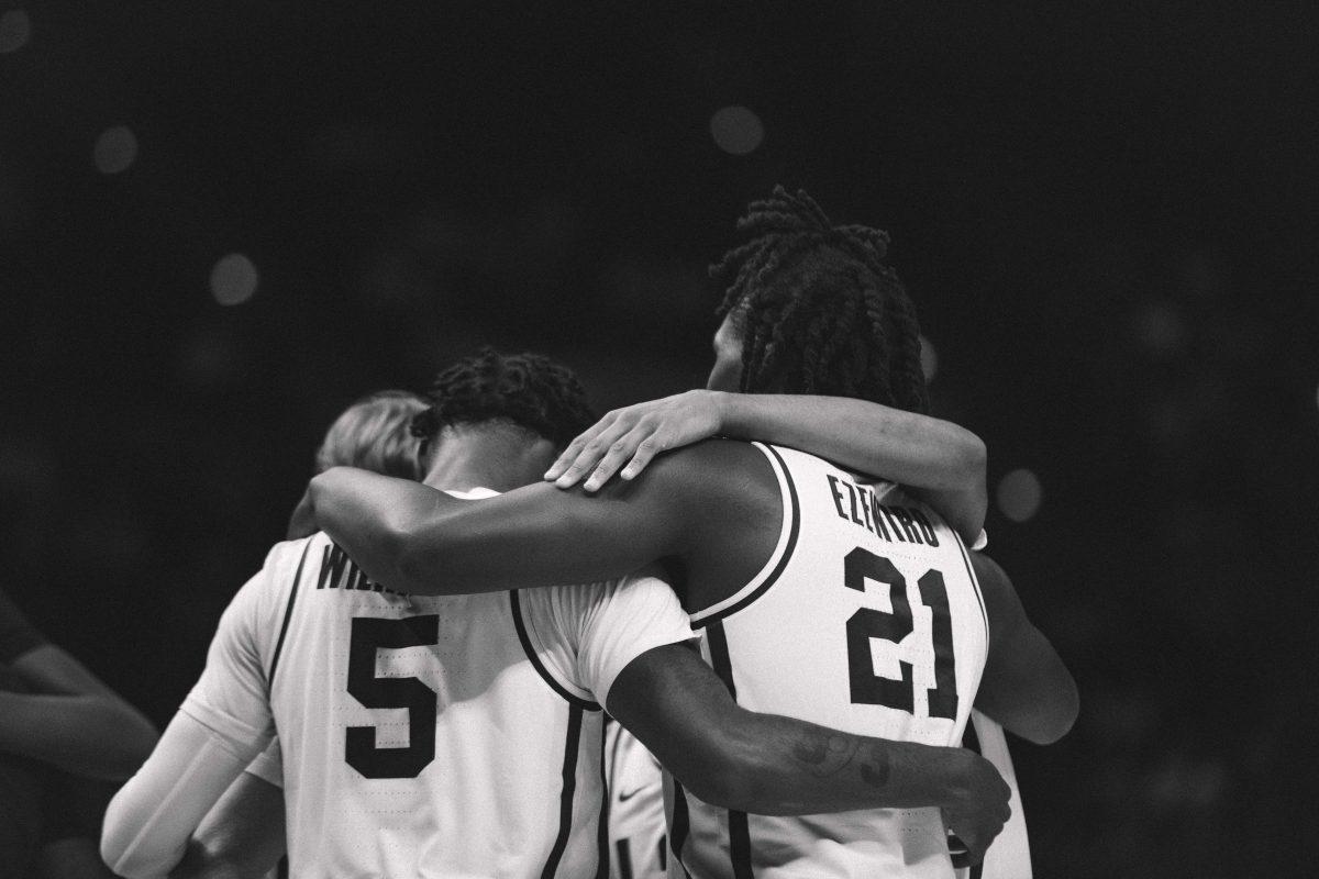 LSU men&#8217;s basketball sophomore forward Mwani Wilkinson (5) and freshman forward Bradley Ezewiro (21) gather around their teammates Friday, Nov. 12, 2021, during LSU&#8217;s 84-59 win against Texas State in the Pete Maravich Assembly Center on North Stadium Drive in Baton Rouge, La.