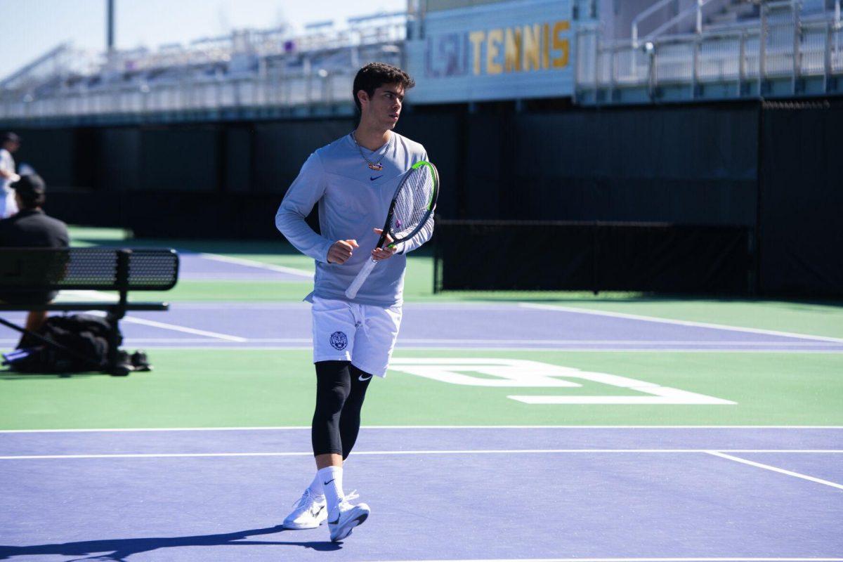 LSU men's tennis sophomore Joao Garca walks on the court Sunday, Feb. 13, 2021 during LSU's 6-1 win over Purdue at the LSU Tennis Complex on Gourrier Avenue in Baton Rouge, La.