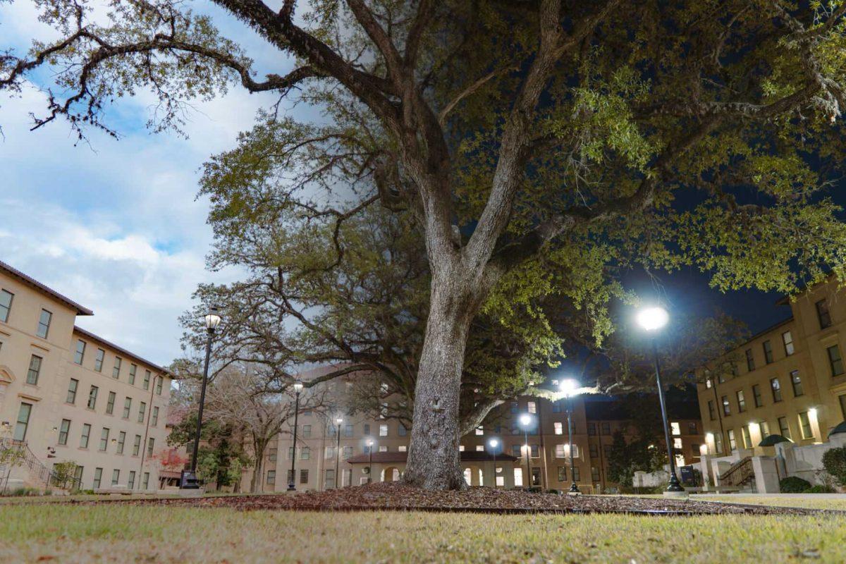 Clouds dot the sky on Tuesday, Jan. 25, 2022, and lights illuminate the scene on the night of Friday, Jan. 28, at the Horseshoe Community on Highland Road in Baton Rouge, La.