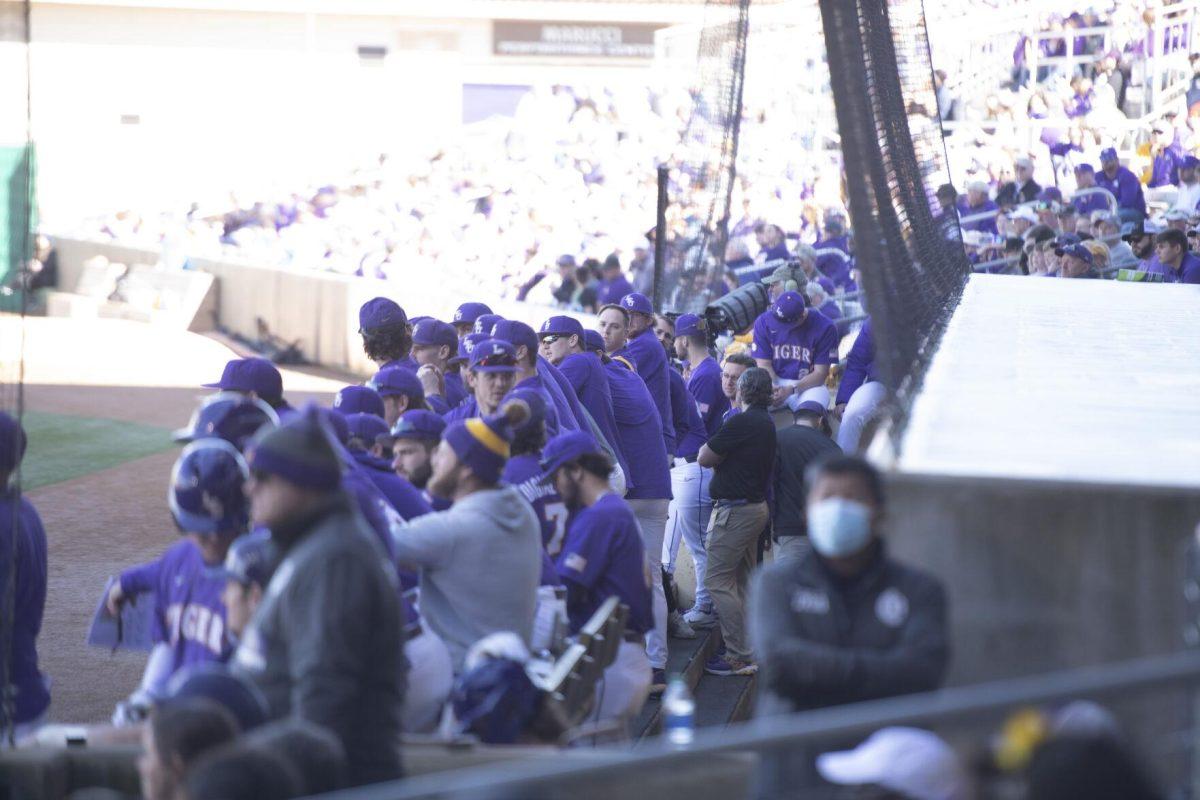 The LSU baseball team watches from the dugout Saturday, Feb. 19, 2022, during the Tigers' 17-8 win against the University of Maine at Alex Box Stadium in Baton Rouge, La.