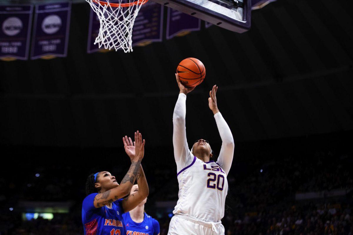 LSU women’s basketball sophomore center Hannah Gusters (20) shoots a layup Sunday, Feb. 20, 2022, during LSU’s 66-61 win against Florida in the Pete Maravich Assembly Center on North Stadium Drive in Baton Rouge, La.
