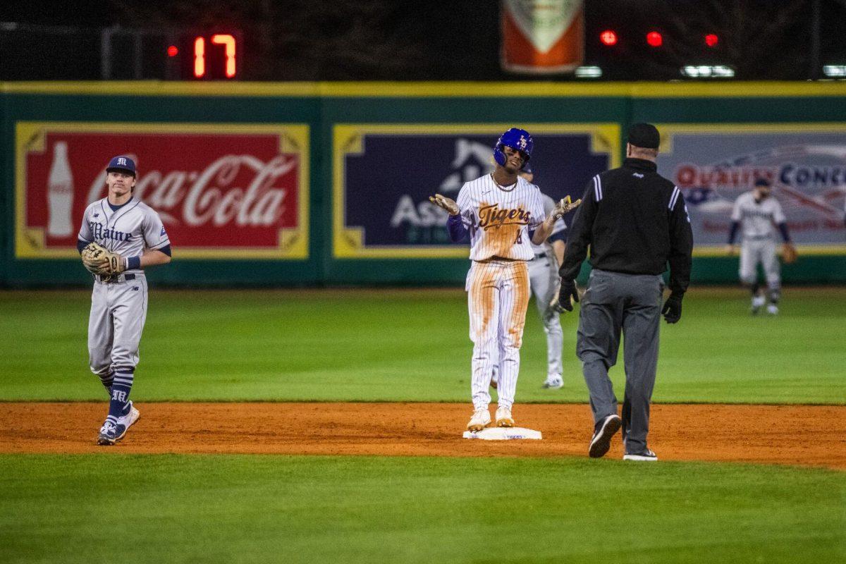 LSU baseball sophomore first baseman Tre Morgan III (18) shrugs his shoulders after hitting a double Friday, Feb. 18, 2022 before LSU's 13-1 win against Maine at Alex Box Stadium on Gourrier Avenue in Baton Rouge, La.