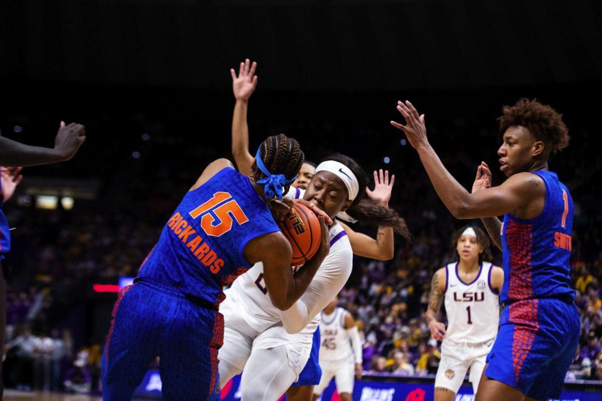 LSU women’s basketball graduate student center Faustine Aifuwa (24) fights for the ball Sunday, Feb. 20, 2022, during LSU’s 66-61 win against Florida in the Pete Maravich Assembly Center on North Stadium Drive in Baton Rouge, La.