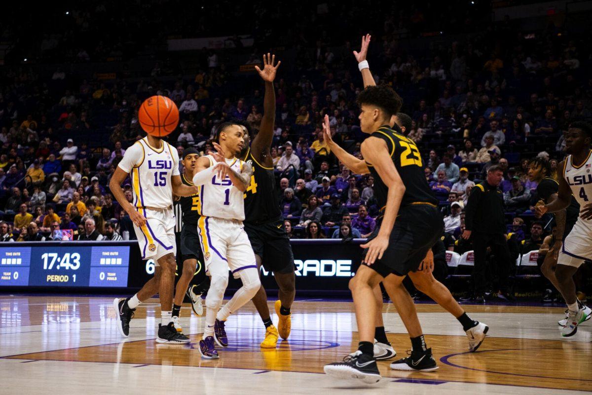 LSU men&#8217;s basketball senior guard Xavier Pinson (1) makes a no-look pass to freshman guard Brandon Murray (0) Saturday, Feb. 26, 2022, during LSU&#8217;s 75-55 win against Missouri in the Pete Maravich Assembly Center on North Stadium Drive in Baton Rouge, La.