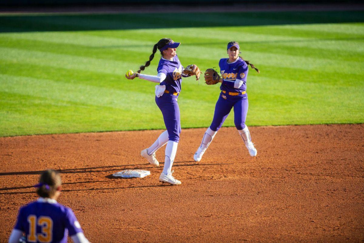 LSU softball redshirt sophomore infielder Taylor Pleasants (17) throws the ball to first Friday, Feb. 11, 2022, during the Tigers' 3-0 win against South Alabama at Tiger Park in Baton Rouge, La.