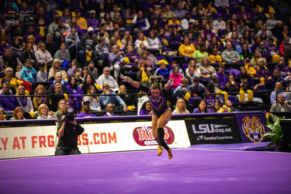 LSU gymnastics freshman all-around KJ Johnson prepares to flip in her floor routine Friday, Feb. 18, 2022 during LSU's 198.050-197.650 win over the University of Alabama in the Pete Maravich Assembly Center on N. Stadium Drive in Baton Rouge, La.