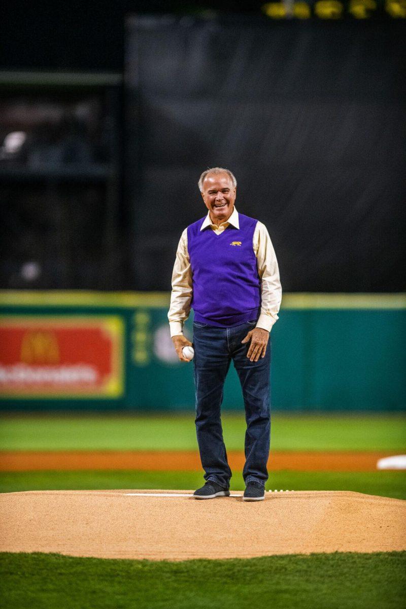 Former head coach Paul Mainieri throws out the first pitch Friday, Feb. 18, 2022 before LSU's 13-1 win against Maine at Alex Box Stadium on Gourrier Avenue in Baton Rouge, La.