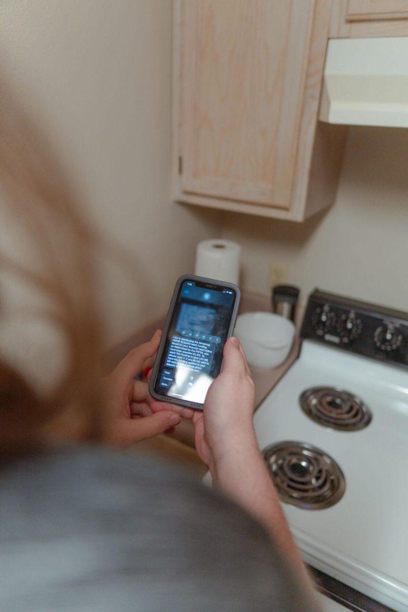 LSU sophomore animal sciences major Joey Grana reads his HEERF text message on Sunday, Feb. 13, 2022, while in his apartment in Baton Rouge, La.