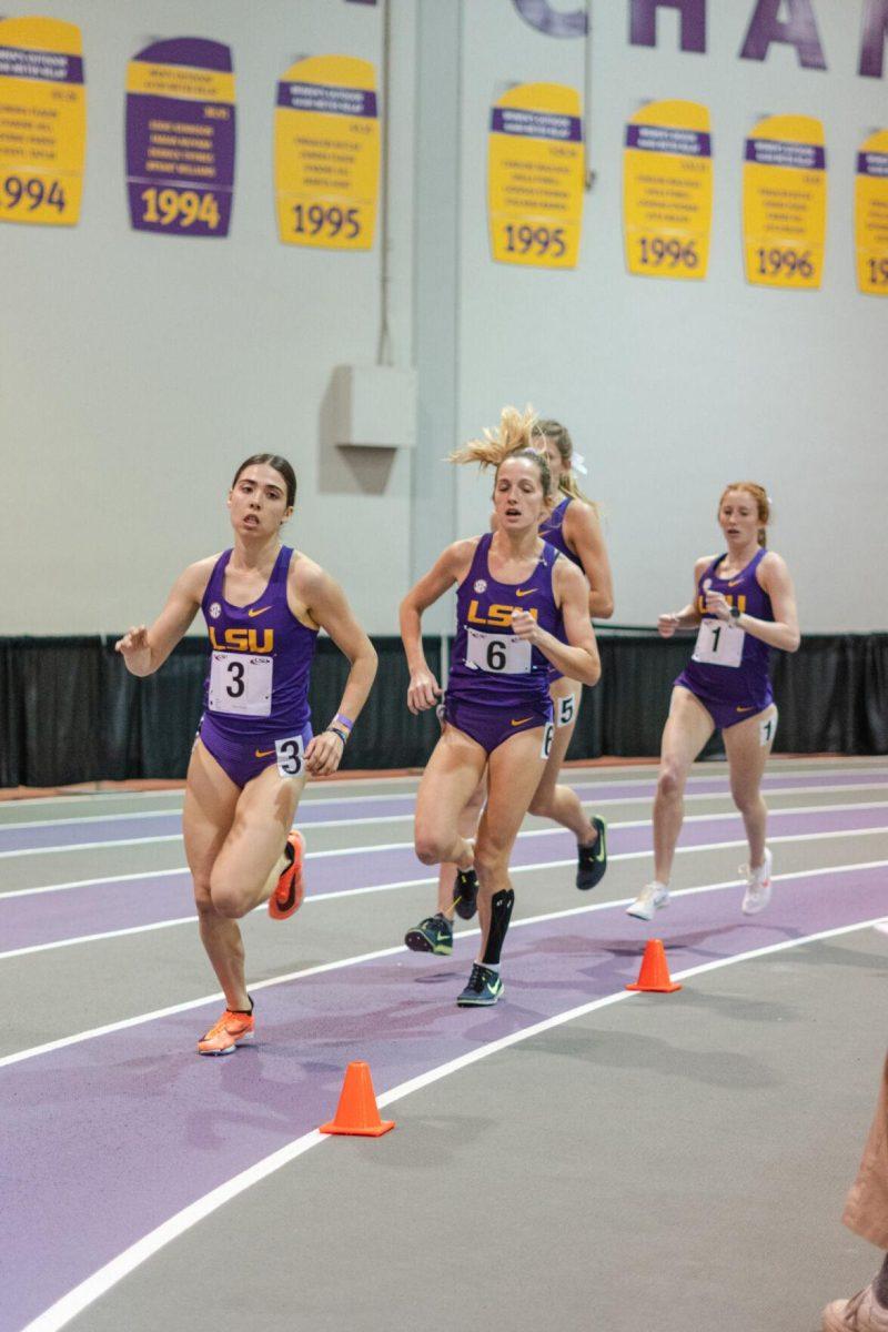 LSU track and field distance runners round the bend on Friday, Feb. 18, 2022, during the LSU Twilight track and field meet in the Carl Maddox Field House on Nicholson Drive in Baton Rouge, La.