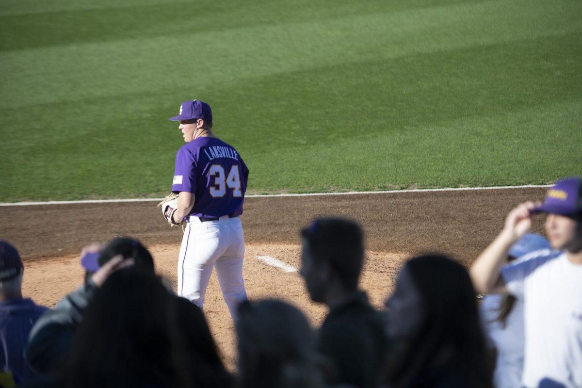 LSU freshman pitcher Cole Lansville (34) practices pitching Saturday, Feb. 19, 2022, during the Tigers' 17-8 win against the University of Maine at Alex Box Stadium in Baton Rouge, La.