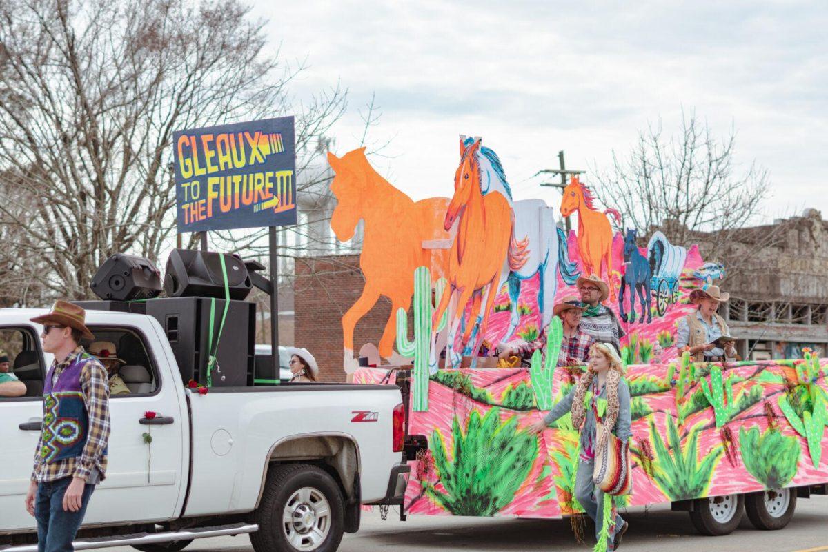 The &#8220;Gleaux to the Future III&#8221; float rolls down the street on Sunday, Feb. 20, 2022, as part of the Mid City Gras parade on North Boulevard in Baton Rouge, La.