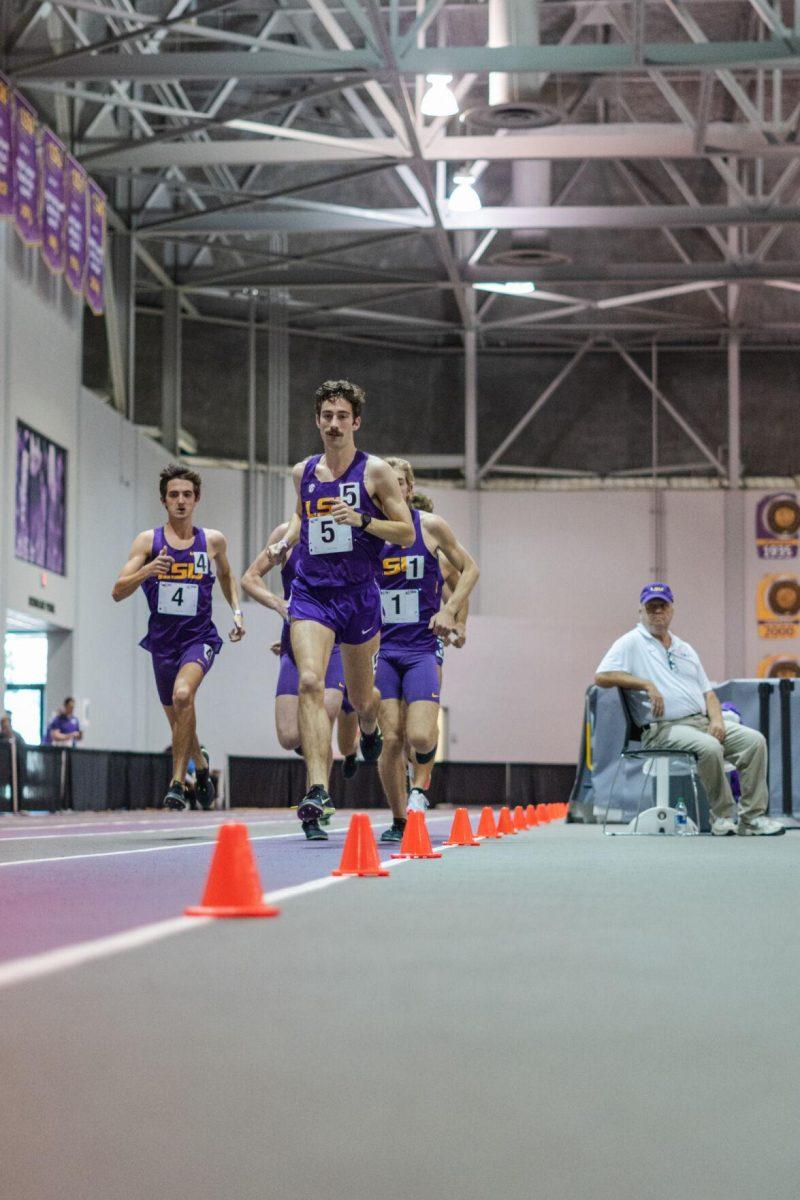 LSU track and field distance sophomore Garrett Hamilton leads the pack on Friday, Feb. 18, 2022, during the LSU Twilight track and field meet in the Carl Maddox Field House on Nicholson Drive in Baton Rouge, La.