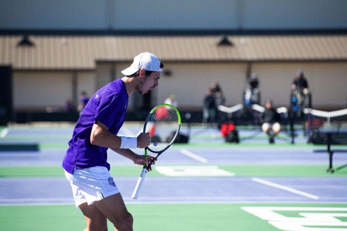 LSU men's tennis sophomore Benjamin Ambrosio lets out a scream after winning the point Sunday, Feb. 13, 2021 during LSU's 6-1 win over Purdue at the LSU Tennis Complex on Gourrier Avenue in Baton Rouge, La.