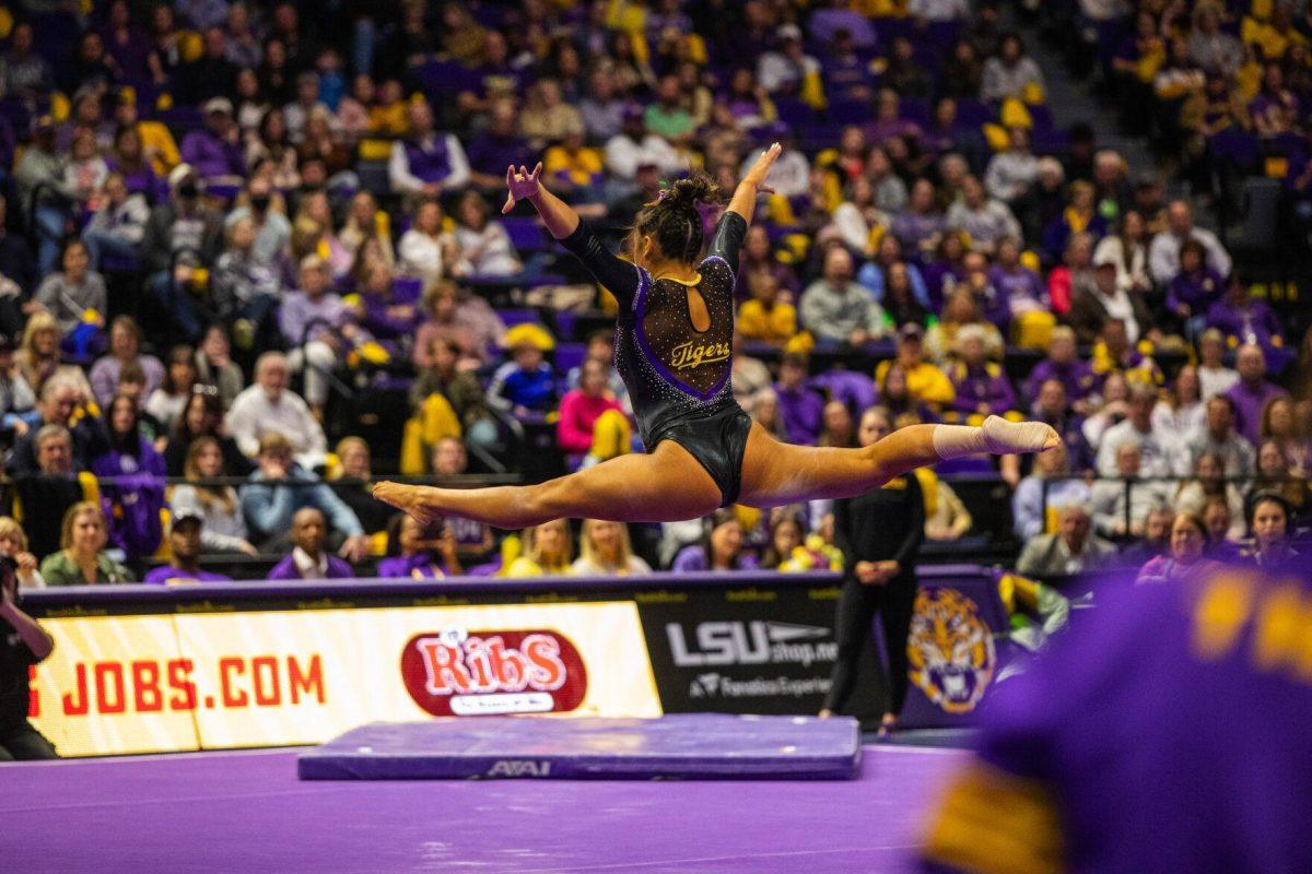 LSU gymnastics freshman all-around Aleah Finnegan performs a split mid air in her floor routine Friday, Feb. 18, 2022 during LSU's 198.050-197.650 win over the University of Alabama in the Pete Maravich Assembly Center on N. Stadium Drive in Baton Rouge, La.