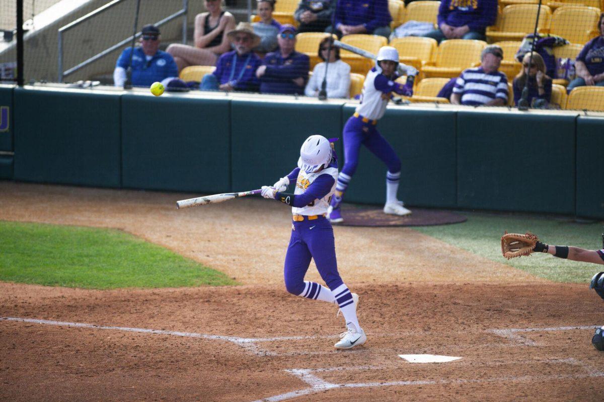 LSU softball sophomore infielder Danieca Coffey (13) hits the ball Saturday, Feb. 12, 2022, during LSU’s 8-1 win against South Alabama at Tiger Park on Skip Bertman Drive in Baton Rouge, La.