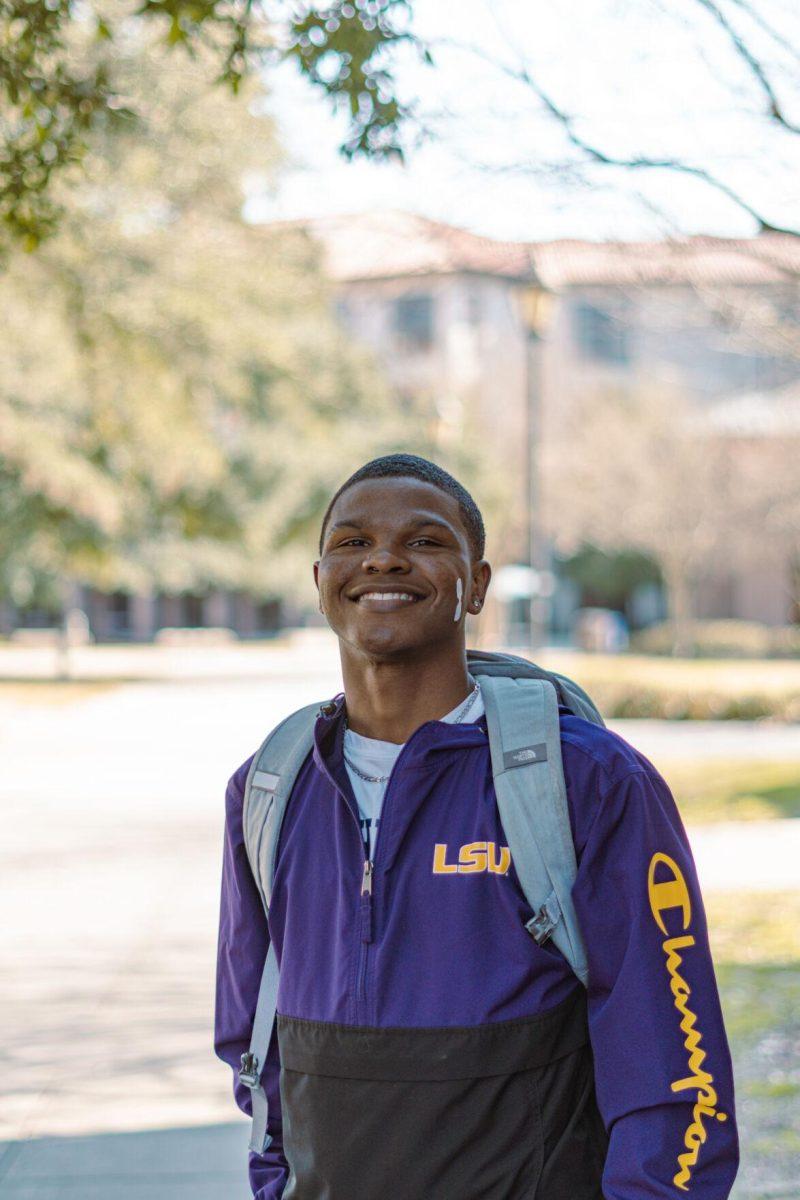 LSU junior graphic design major Robert Weathersby sports an LSU jacket on Tuesday, Feb. 15, 2022, near North Hall on Cypress Drive in Baton Rouge, La.