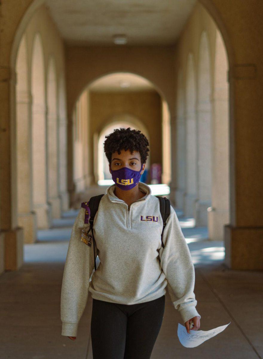 LSU freshman natural resource and ecology management major Madison Pigott sports both an LSU mask and jacket on Tuesday, Feb. 8, 2022, while walking to class in the Quad in Baton Rouge, La.