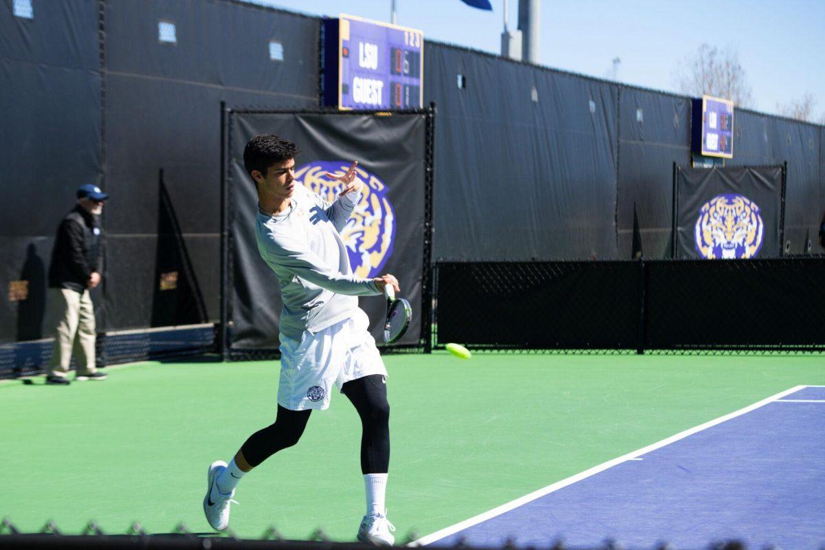 LSU men's tennis sophomore Joao Garca hits the ball Sunday, Feb. 13, 2021 during LSU's 6-1 win over Purdue at the LSU Tennis Complex on Gourrier Avenue in Baton Rouge, La.
