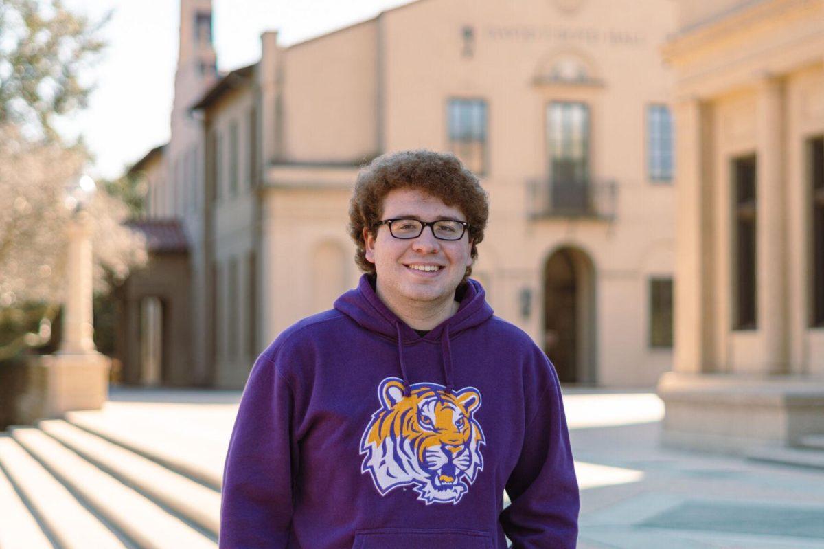 LSU sophomore general business major Lloyd Passafume wears a Mike the Tiger sweatshirt on Thursday, Feb. 10, 2022, in front of Memorial Tower on Tower Drive in Baton Rouge, La.