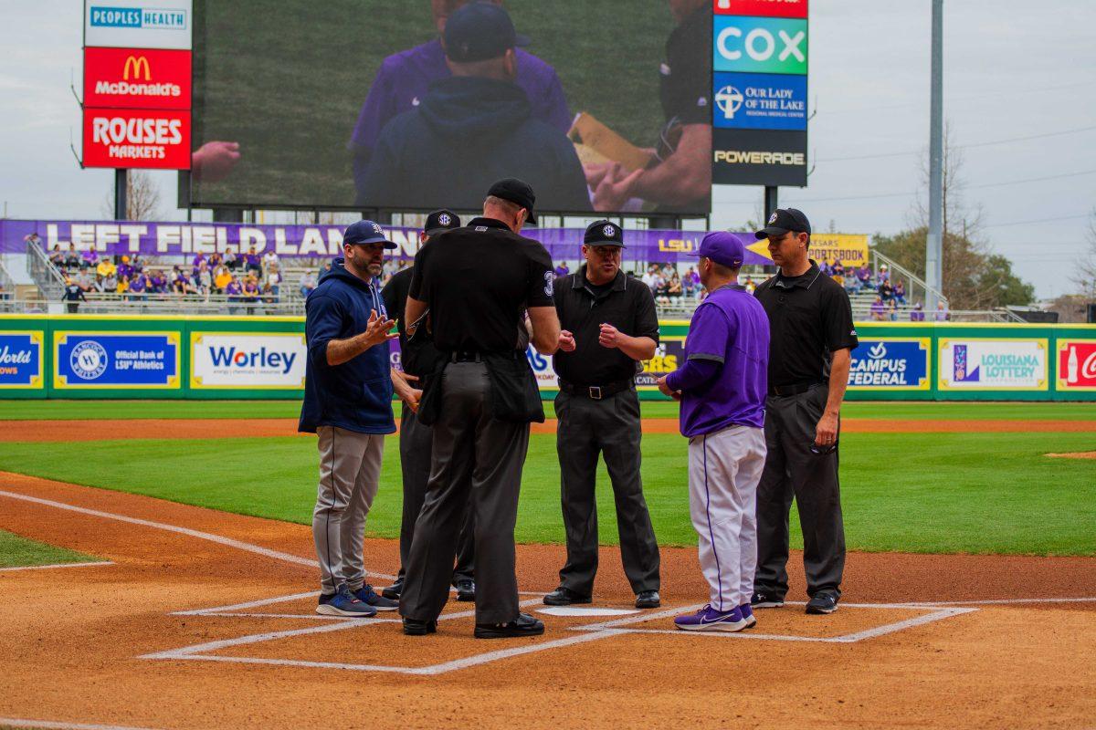 LSU baseball head coach Jay Johnson and Maine head coach Nick Derba speak to the referees Sunday, Feb. 20, 2022 before LSU's&#160;21-6 win against Maine at Alex Box Stadium on Gourrier Avenue in Baton Rouge, La.