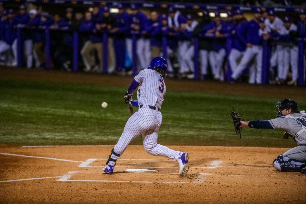 LSU baseball sophomore outfielder Dylan Crews (3) hits the ball Friday, Feb. 18, 2022 during LSU's 13-1 win against Maine at Alex Box Stadium on Gourrier Avenue in Baton Rouge, La.