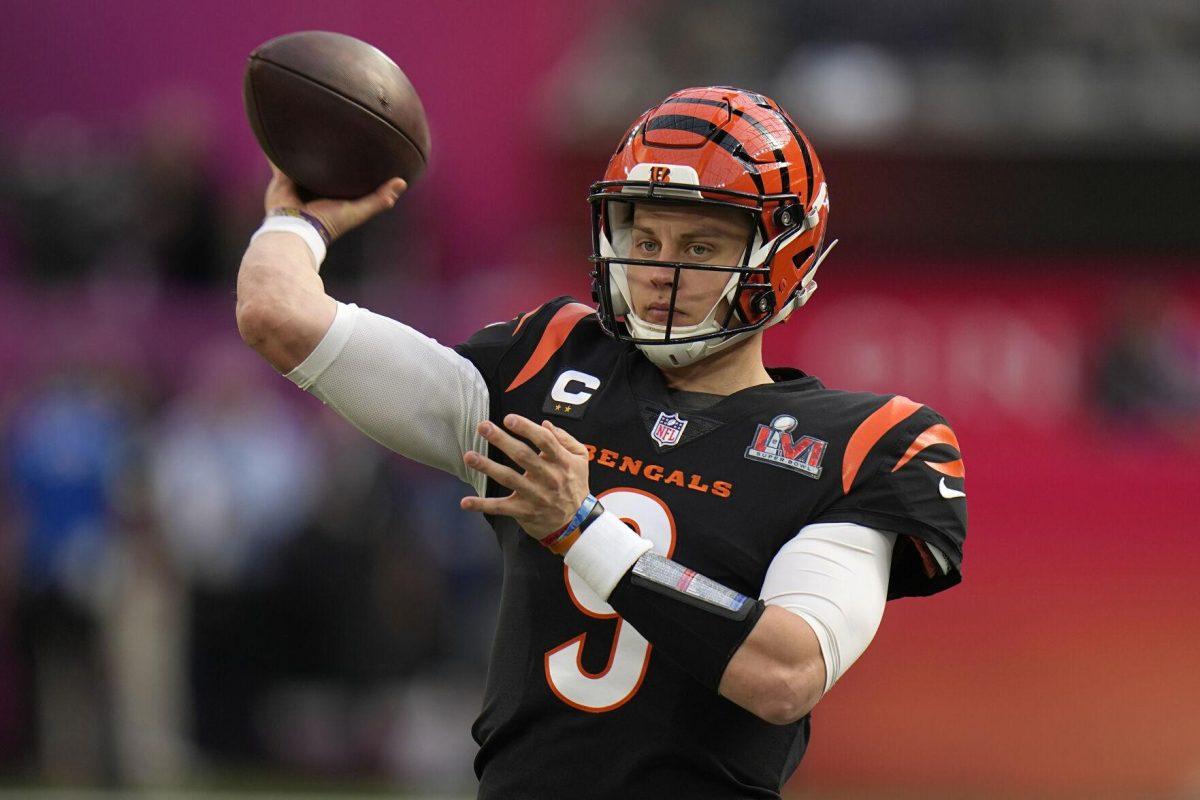 Cincinnati Bengals quarterback Joe Burrow (9) warms up before the NFL Super Bowl 56 football game against the Los Angeles Rams, Sunday, Feb. 13, 2022, in Inglewood, Calif. (AP Photo/Chris O'Meara)